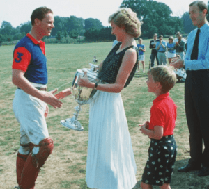 Princess Diana presents Major James Hewitt with a trophy at a polo match in 1986. Credit: Shutterstock.