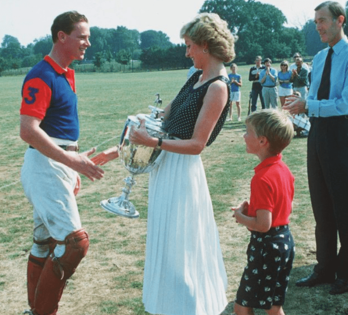 Princess Diana presents Major James Hewitt with a trophy at a polo match in 1986. Credit: Shutterstock.
