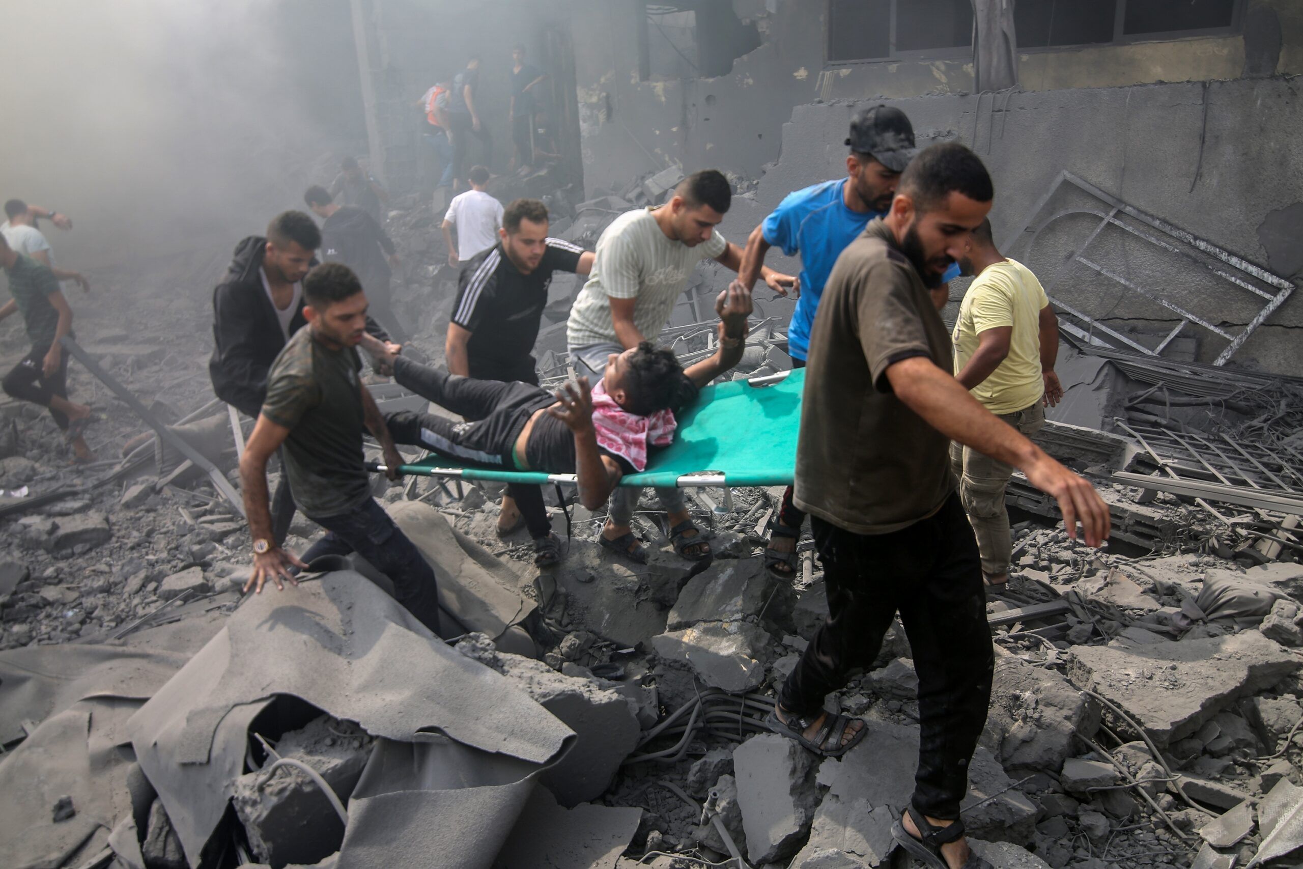 Palestinians look for survivors after an Israeli airstrike in Rafah refugee camp, southern Gaza Strip, on October 12 2023. Credit: Shutterstock: Anas-Mohammed