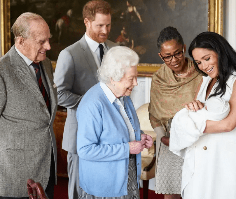 Queen Elizabeth and Prince Phillip meet baby Archie. Credit: supplied.