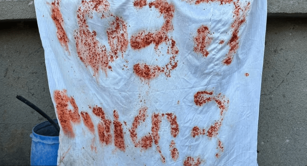 A search of the building where the three hostages were shot dead revealed messages like "SOS" and "Help, 3 hostages" written on fabric using food scraps. It's unclear if the hostages had been abandoned by their captors or had escaped. Credit: Israel Defense Forces.