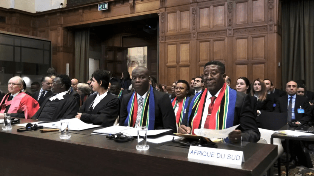 South African officials attend the opening of hearings at the International Court of Justice to determine whether Israel’s war with Hamas amounts to genocide against Palestinians, in The Hague, Netherlands, Jan. 11, 2024. Credit: YouTube.