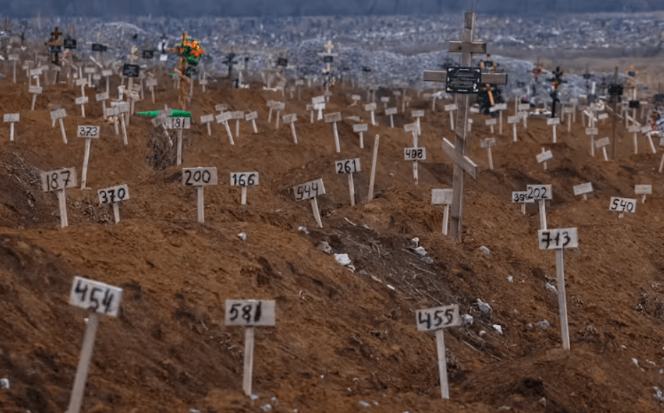 Numbers mark the graves of unidentified people killed in Mariupol. Sergei Ilnitsky/EPA