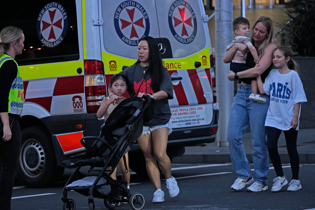 Shoppers frantically evacuated the shopping centre after the attack. Credit: AP Photo/Rick Rycroft.