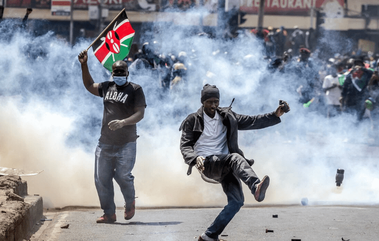 Hundreds of protesters broke through barriers erected by the police outside parliament in the capital Nairobi. Credit: AFP