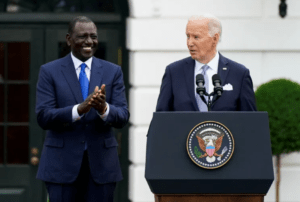 US President Joe Biden speaks as Kenyan President William Ruto applauds during a White House state arrival ceremony on the South Lawn of the White House in Washington, DC, on May 23, 2024. Credit: Elizabeth Frantz/Reuters