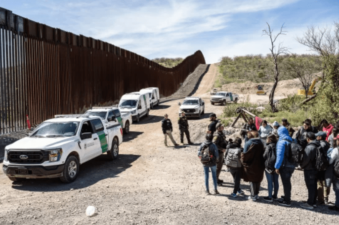 Border Patrol picks up a group of asylum-seekers from an aid camp at the U.S.-Mexico border near Sasabe, Ariz., on March 13. Credit: Justin Hamel / Bloomberg via Getty 