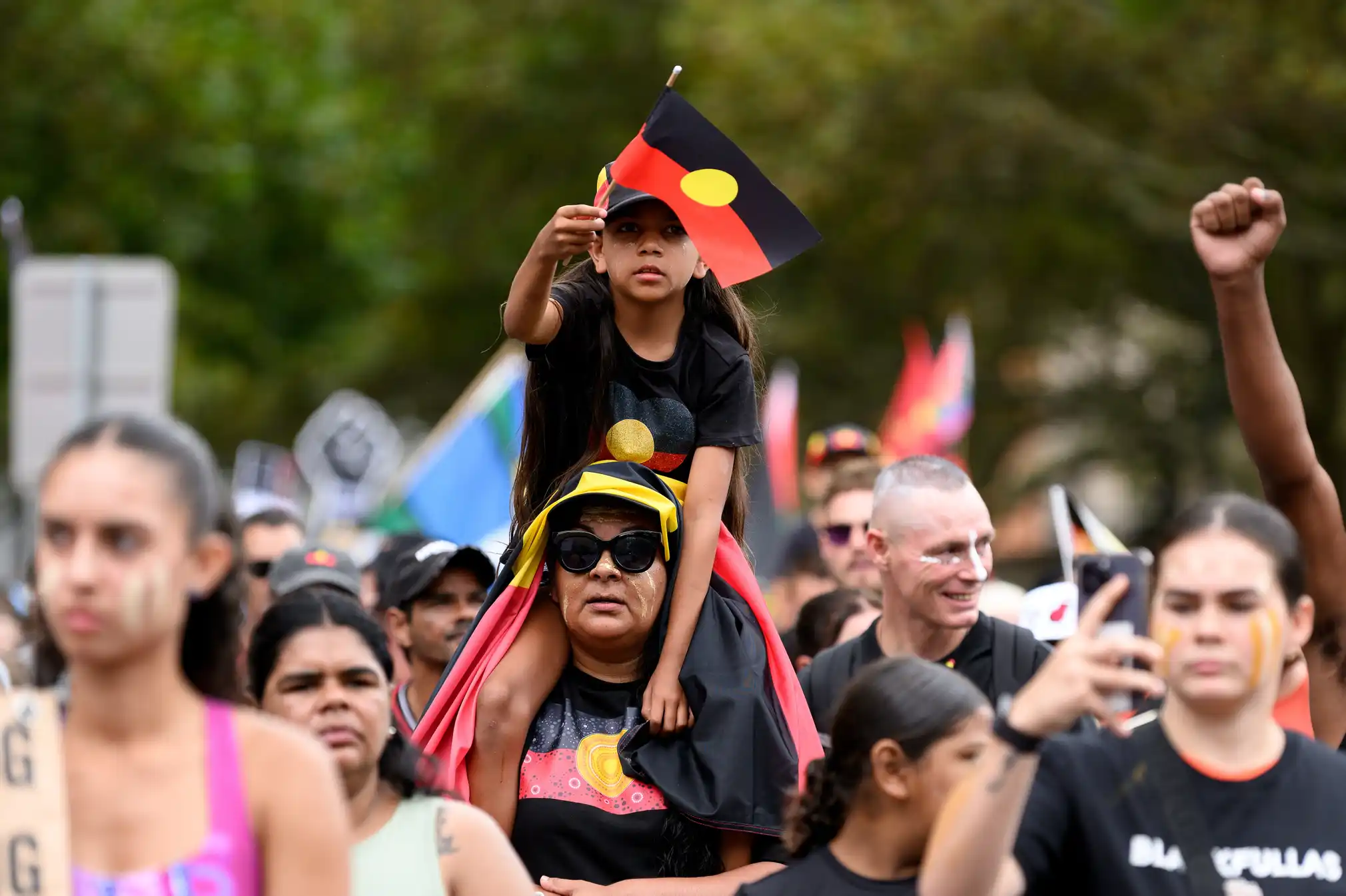 Protesters are seen in Sydney. Credit: Steven Markham/EPA