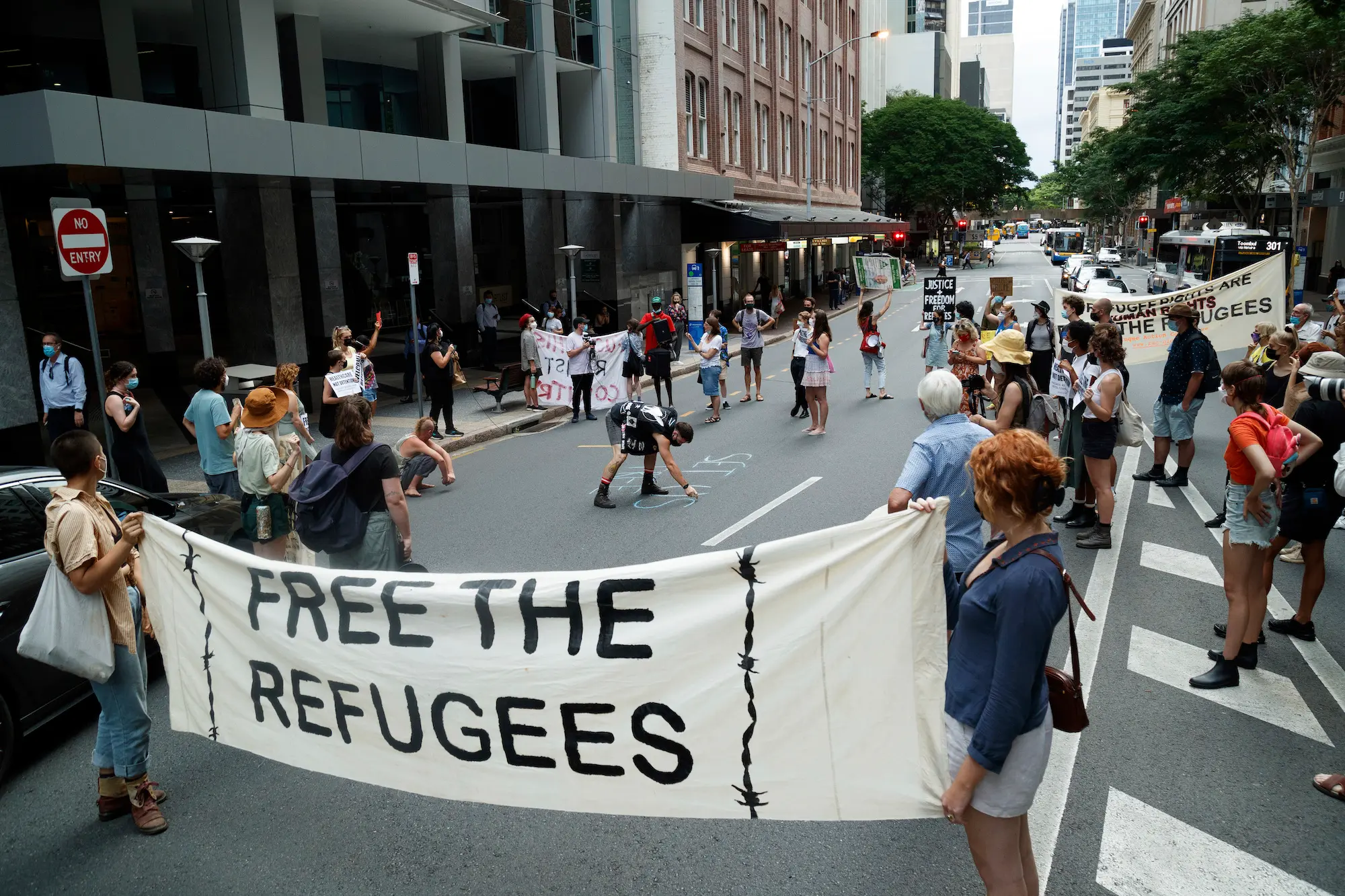 Activists gather in Brisbane's ANZAC Square to protest the indefinite detention of refugees and asylum seekers in Australian-run and funded facilities on the mainland and on Papua New Guinea's Manus Island, January 19, 2022. Credit: SOPA Images